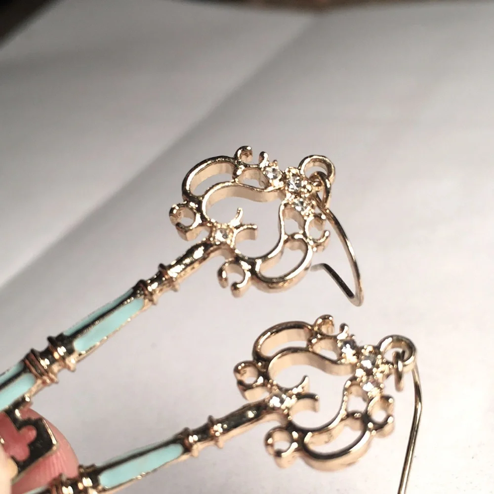Gold tone crystal embellished blue enamel retro key pierced wire earrings - Picture 12 of 17